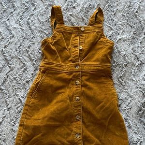 A mustard colored crew cut size 6 coverall dress with pockets!